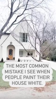 a white house with a sign that says, the most common mistake i see when people paint their house white