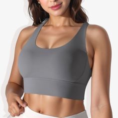 The Anna-Kaci Women's Scoop Neck Stretchy Cropped Banded Cup Seam Sports Bra is a stylish and functional addition to your activewear collection. This athletic top features a scoop neckline and a cropped design, providing a modern and sleek look. The banded cup seams and double-layering offer excellent support and a flattering fit. Made from 4-way stretch fabric, this sports bra ensures maximum flexibility and comfort during any workout. The padded cups add extra support and comfort, making it pe Gray High Stretch Casual Sports Bra, Solid Scoop Neck Sports Top, Solid Color Scoop Neck Sports Top, Sporty Tops With Medium Bust Support For Gym, Casual Activewear With Medium Bust Support And High Stretch, Athleisure Tops With Medium Bust Support For Sports, Sportswear Tops With Medium Bust Support And High Stretch, High Stretch Sportswear Tops With Medium Bust Support, Casual Gray Breathable Sports Bra