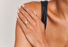 a woman's arm with a ring on it