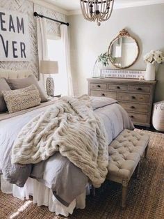 an instagram photo of a bed with blankets and pillows