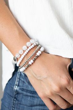 Paparazzi Accessories- Layered Luster - White  Bracelet Item #P9WH-WTXX-185XX   A mismatched assortment of silver, white, and crackling white glass-like beads are threaded along stretchy bands around the wrist, creating colorful layers.   Sold as one set of four bracelets. Bracelet Photoshoot Ideas, Bracelet Photoshoot, Bracelet Photography, Iris Jewelry, Bracelet Photo, Jewelry Photography Styling, White Bracelet, Jewelry Photoshoot, Bracelet Display