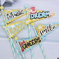 birthday cake toppers with the words happy, smile, magic, dream and more on them