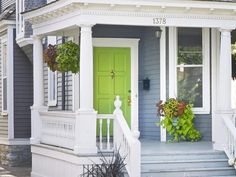 a green door is on the front of a house