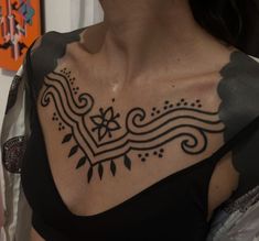 a woman with a tattoo on her chest