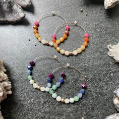 Wonderful quality, handcrafted hoops are adorned with AAA star cut faceted gemstones in 2 gorgeous ombrè colorways, pinks and blues. Oh my! These measure 1.75 inch in diameter and are super lightweight. These gemstone hoops can be ordered in 14k gold filled or sterling silver. What is 14k Gold Fill? It's an actual layer of gold-pressure bonded to another metal. Gold filled is not to be confused with gold plating as filled literally has 100% more gold than gold plating. Gold filled is much more v Cork Bracelet, Cute Business Cards, Gold Bubbles, Gemstone Hoop Earrings, Dragonfly Pendant, Faceted Gemstones, Gold Filled Jewelry, Jewelry Earrings Hoops, Huggies Earrings