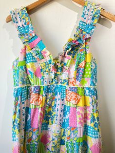 Lilly Pulitzer Pastels Baby Doll Maxi Dress. Empire waist cut, maxi length. Fun and colorful patchwork pattern throughout. Ruffled neckline that goes up into the shoulder straps of the dress. Zipper closure going up the back. Has an interior half-slip. Linen-cotton blend. Excellent vintage condition, marked size 6. Approx. Measurements Length: 56" Underarm to Underarm: 16 1/2" Fun Multicolor Dresses For Garden Party, Fun Multicolor Dress For Garden Party, Multicolor Vacation Dresses With Ruffled Straps, Multicolor Dresses With Ruffled Straps For Vacation, Multicolor Ruffled Straps Dress For Garden Party, Fitted Multicolor Dress With Ruffled Straps, Multicolor Dress With Ruffled Straps For Garden Party, Multicolor Dresses With Ruffled Straps For Garden Party, Playful Colorful Pattern Dresses For Vacation