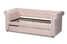 a pink leather daybed with wooden slats and mattress on the bottom bed frame