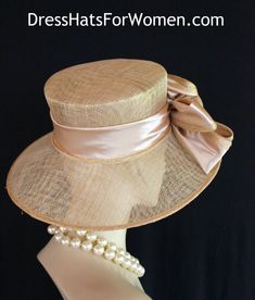 Ladies Metallic Gold And Champagne Beige  Wide Brim Sinamay Straw Designer Fashion Church Wedding Hat. The Bow Can Be Worn Toward The Front Of The Face Or Toward The Back Of The Head. This Dress Hat Is Suited For Weddings, Formals, Bridal, Mother Of The Bride, The Kentucky Derby, The Melbourne Cup, The Royal Ascot,  And Horse Races.

Measurements: Crown Measures 22.5".  This lovely headpiece is suited for Spring, Summer or Early Fall.

All Sales Are Final. Fitted Short Brim Straw Hat For Church, Fitted Brimmed Straw Hat For Church, Fitted Straw Hat With Short Brim For Church, Elegant Gold Straw Hat With Flat Brim, Fitted Top Hat For Church And Royal Ascot, Classic Adjustable Straw Hat For Weddings, Classic Fitted Fascinator With Wide Brim, Adjustable Brimmed Boater Hat For Wedding, Short Brim Top Hat For Church