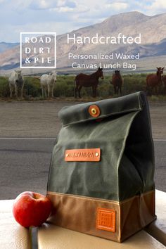 Wild horses in the background, this large waxed canvas lunch bag with a personalized leather patch, makes a great gift.