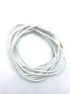 Beautiful vibrant white waist beads, gorgeous on any skin tone! These waist beads have metallic clasps.Waist beads, Boho waist beads, African waist beads, Belly Chain, Boho Beads, Belly Beads - White Waist Beads**** PROPERLY MEASURE YOUR WAIST ****Place the measuring tape at the exact area you prefer to wear the waist beads.Do not tuck in your stomach when measuring for belly chain.Allow for wiggle space when measuring for breathing room.Thank you for shopping with us! Adjustable White Beaded Chain Waist Beads, Adjustable White Beaded Waist Beads, Adjustable White Waist Beads, Adjustable White Beaded Chain, Festival White Beaded Chain Waist Beads, White Waist Beads With Tiny Beads As A Gift, Handmade Adjustable White Waist Beads, Adjustable Handmade White Waist Beads, White Beaded Waist Beads As A Gift