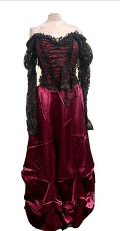 This is a rare vintage Raven outfit. The top has gathered black lace sleeves which can be worn both on  or off the the shoulders. The top has a zip in the back and medium fits a chest 34/36 inch .  The skirt it a plum satin and has an elasticated waist with a zip . Fits Up to a 36 inch waist. It also comes with a cameo brooch with diamanté . Thank you for looking Gothic Corset For Costume Party In Fall, Vintage Corset For Halloween And Alternative Fashion, Vintage Corset For Halloween, Vintage Long Sleeve Victorian Dress For Halloween, Black Vintage Victorian Overbust Dress, Victorian Lace Trim Dress For Costume Party, Vintage Halloween Costume Corset Dress, Vintage Victorian Dress For Halloween Party, Vintage Long Sleeve Corset Dress For Costume Party