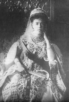 an old black and white photo of a woman wearing a tiara