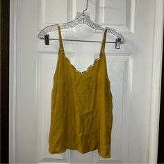 Nwt Hem & Thread Mustard Yellow V Neck Scalloped Cami Tank Size Small. Brand New With Tags. V Neck With Scalloped Trim. Sleeveless. 100% Polyester Approximate Measurements: Bust: 16in Flat Length:23in Yellow Spaghetti Strap Tank Top For Vacation, Yellow Cami Tank Top For Day Out, Gold Cami Top For Summer, Fitted Yellow Casual Camisole, Summer Yellow Camisole With Spaghetti Straps, Yellow Camisole Summer Tops, Yellow Fitted Camisole For Spring, Yellow Summer Camisole Top, Yellow Spaghetti Straps Summer Camisole