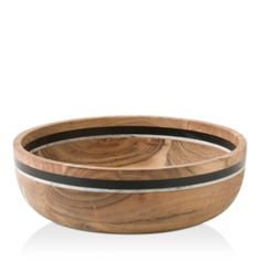 a wooden bowl with black stripes on it