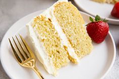 a slice of white cake on a plate with a fork