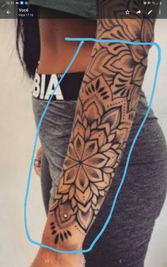 a woman's arm with an intricate tattoo design on the left side of her arm