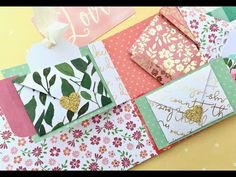 several different types of cards and envelopes on top of each other with the words love