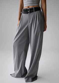 Color: Light Grey Midweight woven fabric Regular fit Wide leg Front pleated detailing Side seam pockets Back welt pockets Belt loops Zip fly Hook and bar closure Unlined 68% Lyocell  29% Viscose 3% Elastane Dry Clean By The Frankie Shop. Imported Gray Tapered Leg Pants With Belt Loops, Gray High Waist Pants For Business Casual, Elegant Gray Wide Leg Pants With Pockets, Gray Wide-leg Office Bottoms, Gray High Waist Wide Leg Pants With Pockets, Classic Gray Wide Leg Pants For Work, Gray Straight Pants With Belt Loops, Gray Wide Leg Pants With Belt Loops For Work, Gray Wide Leg Pants For Spring Workwear