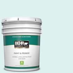 the behr paint and primer in one is shown on a gray background with white trim