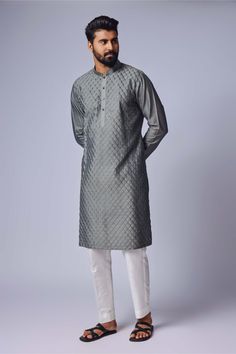 Editor's Note The gray pintuck kurta and pant set in cotton silk offers a blend of sophistication and comfort. The kurta and pyjama combination is perfect for formal occasions or festive celebrations, exuding an elegant and refined look. Embrace the timeless appeal of this maroon pintuck kurta set for a stylish and graceful appearance. Fabric: Cotton silk Color: Gray Components: Kurta and pants Occasion: Festive Note: Product colour may slightly vary due to photographic lighting sources Care: Dr Grey Kurta, Kurta For Men, Kurta Set For Men, Kurta Pyjama, Vacuum Storage, Silk Kurta, Pajama Pant, Gray Silk, Fashion App