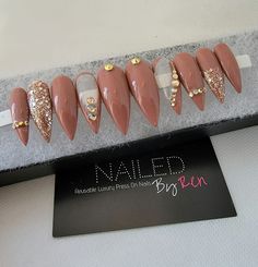 Sylvia Show off with this beautiful set of gel nails. Nails are made with hard gel and nail foils. This set contains 10 nails (size Med - 1,5,4,6,8)  Stiletto nails, Builder gel, Gel polish, Gel top coat, Glitter, Nail gems Nails are reusable and with proper care can last up to 3 weeks.  IF YOU ARE INTERESTED IN THIS SET IN ANOTHER SIZE PLEASE MESSAGE BE BEFORE PLACING AN ORDER TO SEE IF I CAN RECREATE IT FOR YOU IN THE SIZE YOU NEED OTHERWISE WILL RECEIVE THE SET IN THE SIZE LISTED ABOVE Please make sure you order your correct nail size. I am not responsible if your nails do not fit. If you are unsure of your size, please purchase a sample size kit. All sales are final  With each set I also includes the following: Nail Glue  Nail Buffer Nail File Cuticle Pusher Prep Pad Application Instru Stiletto Press On Nails, Feather Nail Art, Gel Top Coat, Nail Buffer, Foil Nails, Gem Nails, Hard Gel, False Nail, Nail Sizes