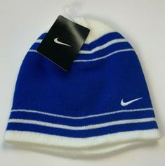 Authentication:  100% Authentic Nike merchandise Hat Description:  Royal blue and white beanie winter hat no cuff Hat Design:  Horizontal royal blue and white stripes with Nike logo embroidered in white on the front Hat Material:  100% Acrylic - Warm and comfortable - Machine washable Hat Size:   Youth boys 8/20 Status:  Brand NEW! Tags:  Official Nike tag still attached! Shipping:  FREE Via USPS!  BUY WITH CONFIDENCE – 100% POSITIVE FEEDBACK!  Check out my eBay store at stores.ebay.com/officerb Classic Blue Winter Hat, Classic Blue Sports Hat, Nike Winter Beanie Hat, Nike Casual Winter Hats, Casual Nike Winter Hat, Warm Blue Cap, White Winter Hat, Beanie Design, Cool Beanies