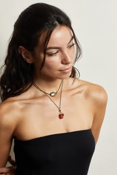 The Beaded Collection contains 8 different styles all handmade in Los Angeles, sourced locally and knotted with nylon string for extra adjustability. Small quantities made of each style made, all contain pyrite beads. The Red Agate Stone promotes safety, grounding and vitality. Material: Red Agate / Pyrite Beads / Black Nylon Cord / Hand knotted Care: Pull on strings lightly to adjust. Remove when showering. Wear and tear will occur on cords over time. Dimensions: 27" Total length. Adjustable to Red Agate Necklace, Rutilated Quartz Necklace, Tiger Eye Necklace, Trio Necklace, Pyrite Necklace, String Necklace, Red Tiger, Tigers Eye Necklace, Sun God