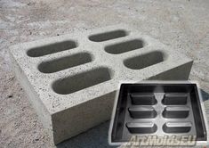 a concrete block with holes in the middle and an open hole on the ground below