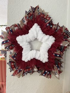 a patriotic wreath hanging on the wall