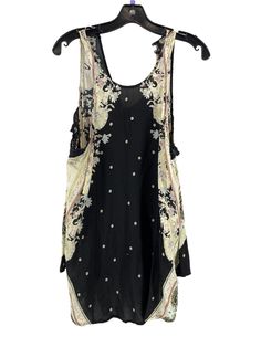 Brand: FREE PEOPLE Style: TUNIC SLEEVELESS Color: MULTI Size: XS SKU: 186-186278-19488 CONDITION: GENTLY USED Black Printed Sleeveless Tank Top, Printed Tank Top For Spring Festival, Black Floral Print Tank Top, Summer Sleeveless Printed Vest, Sleeveless Printed Summer Vest, Sleeveless Printed Tops For Festivals, Printed Sleeveless Summer Vest, Black Sleeveless Festival Vest, Black Floral Print Tank Top For The Beach