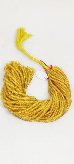 a yellow rope is shown on a white surface