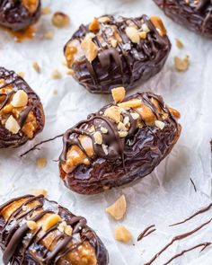 chocolate covered donuts with nuts and drizzled on top