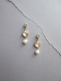 Fine pearl drop and Swarovski crystal earrings, Swarovski crystal bridal earrings, Dangling earrings Elegant Diamond Earrings With Pearl Drop For Wedding, Gold Diamond Earrings With Pearl Drop For Wedding, White Dangle Diamond Earrings For Wedding, Elegant Gold Crystal Earrings With Pearl Charm, Exquisite Pearl Drop Bridal Earrings For Anniversary, Gold Pearl Embellished Earrings For Wedding, Gold Dangle Diamond Earrings With Pearl Drop, Gold Diamond Dangle Earrings With Pearl Drop, Delicate Gold Diamond Earrings For Wedding