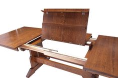 a wooden desk with a drawer on it and a ruler in the middle that is open