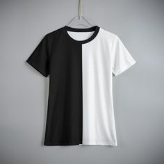 Kids will love the split colors on this soft, comfortable, short sleeve T-Shirt.  Shirt features half black and half white design. Made of high quality jersey fabric that is (95% polyester and 5% spandex). Please use size chart to choose shirt size. Short Sleeve T-shirt With Contrast Panels For Streetwear, Contrast Graphic Print Short Sleeve Top, Contrast Color Graphic Print Short Sleeve Top, White Crew Neck T-shirt With Contrast Color, White Color Block T-shirt For Summer, Black Cotton T-shirt With Contrast Panels, Summer Color Block T-shirt, Black Graphic Tee With Contrast Color, Black Color Block T-shirt For Summer