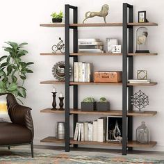 a living room filled with furniture and a book shelf