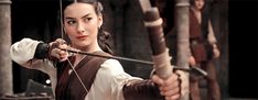 a woman is holding a bow and arrow