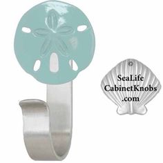 an image of a blue sand dollar on a metal hook with the sealife cabinet knobs com logo below it