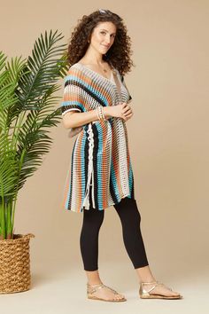 Embrace the island vibes with our Jubilee Striped Crochet Poncho! This tunic-length, oversized fit poncho offers great coverage and a breezy feel. With adjustable lace-up sides, you're in control of your style. Perfect for a relaxed and fashionable beach day! ONE SIZE Tunic Length, Crochet Poncho, Oversized Fits, Beach Day, Lace Up, Lace, Crochet