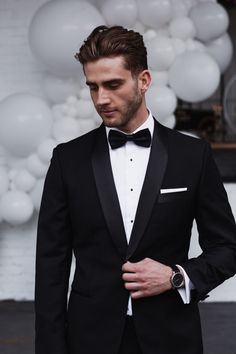 a man in a tuxedo and bow tie