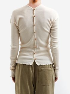 The Baserange Tav Cardigan is a recycled cotton rib button down cardigan that can be worn multiple ways. It features a button placket down the front and back. 60% Recycled Cotton / 40% Cotton Wooden Button Placket Made in Portugal *Model is 5'7 and wears Size Small