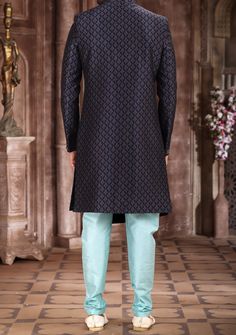 Ready-Made Sherwani With Trouser. All Over Jacquard Brocade Style Printed Fabric Top. Art Dupion Aligarhi Ready Made Trouser. Crafted in Chinese Collar Neck, and Full Sleeve. Satin Lining with Plain Work. High-Quality Matching Buttons. Please Note: The footwear shown in the picture is for presentation and photography purpose only. Color: There might be slight color variation due to lightings and flashes while photo shooting. The color may also vary because of different screen resolutions. Wash C Designer Brocade Sherwani With Chikankari Embroidery, Art Silk Sherwani With Chikankari Embroidery, Straight Kurta, Art Silk Sherwani With Chikankari Embroidery, Chikankari Embroidered Art Silk Sherwani, Anarkali Style Sherwani With Dupatta For Formal Occasions, Formal Brocade Kurta With Chikankari Embroidery, Anarkali Style Sherwani With Resham Embroidery In Art Silk, Brocade Sherwani With Resham Embroidery, Designer Bandhgala With Zari Work In Banarasi Silk