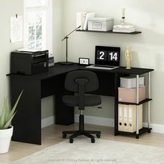 a corner desk with a computer and printer on it