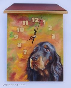 a clock with a painting of a dog on it