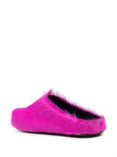 Slip your feet into a cloud of comfort and style with these casually luxurious slippers. Crafted with care, they're perfect for a laid-back day or a quick jaunt outside. You might forget you're even wearing them—until someone compliments you. Fuchsia pink calf hair and leather for a bold statement Easy slip-on style for convenience Round toe design for added comfort Durable rubber sole for reliable traction Made in Italy with top-tier craftsmanship Perfect for the Fall/Winter 2024 season Availab Luxury Rubber Sole Flats For Fall, Luxury Round Toe Platform Slippers With Leather Sole, Luxury Leather Sole Platform Slippers With Round Toe, Luxury Flats With Rubber Sole And Round Toe, Luxury Pink Leather Shoes With Rubber Sole, Luxury Sandals With Rubber Sole And Round Toe, Luxury Slip-on Calf Leather Slippers, Luxury Calf Leather Slip-on Slippers, Marni Sandals