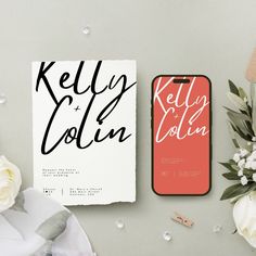 the wedding stationery is laid out next to some flowers and an iphone case that says, kelly & colin