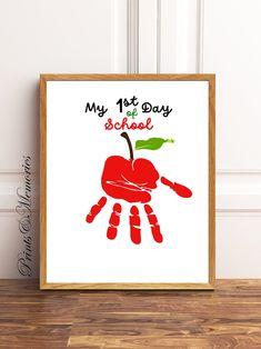 an art print with the words, my 1st day school and handprinted red apple