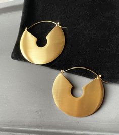 A brushed texture arc style earrings that feature 14k gold plated titanium and a brushed/matte finish Matte Gold Round Tarnish Resistant Earrings, Modern Gold Crescent Earrings, Minimalist Gold Jewelry With Brushed Finish, Modern Gold Crescent Hoop Earrings, Modern Everyday Jewelry With Brushed Finish, Modern Semi-circle Earrings For Everyday, Modern Semi-circle Earrings For Everyday Wear, Matte Gold Round Earrings, Everyday Modern Jewelry With Brushed Finish