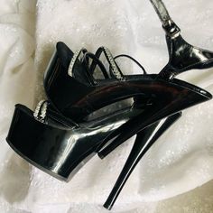 New, Never Worn In Black And Sliver. Heels Are 5 Inches Slick And Sexy. For That Special Date. No Damage, No Flaws, Original Price $125.00 From A Smoke Free Home. Make A Reasonable Offer. Shiny Open Toe Heels For Formal Occasions, Formal Shiny Open Toe Heels, Shiny Open Toe Heels For Party, Party Heels With Rhinestones In Patent Leather, Shiny High Heels For Evening, Black Heels With Silver Accents For Evening, Metallic Fitted Heels For Night Out, Fitted Silver High Heels, Glamorous Metallic Heels For Night Out