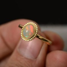 Natural Opal Ring Sterling Silver Yellow Gold Plated Elegant Opal Cabochon Ring, Oval Cabochon Opal Ring With Polished Finish, Elegant Oval Pink Opal Ring, Elegant Pink Opal Oval Jewelry, Elegant Ethiopian Opal Cabochon Rings, Fine Jewelry Opal Ring Oval Cabochon Birthstone, Oval Cabochon Opal Ring Fine Jewelry, Fine Jewelry Opal Oval Cabochon Ring, Oval Cabochon Opal Ring In Fine Jewelry